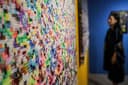 Seniman Agus Baqul menghadirkan karya Dunia Atas Bawah dan No Holyday No Holyland berupa manik-manik huruf penuh warna.